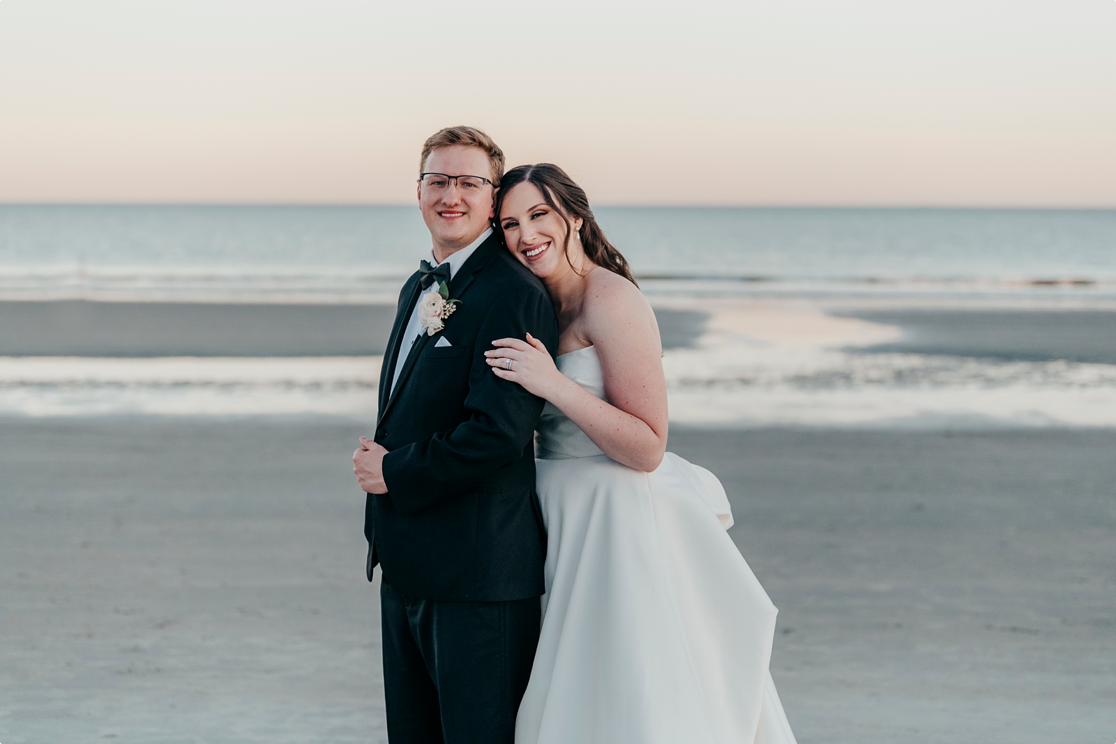 bride and groom wedding photos on beach 