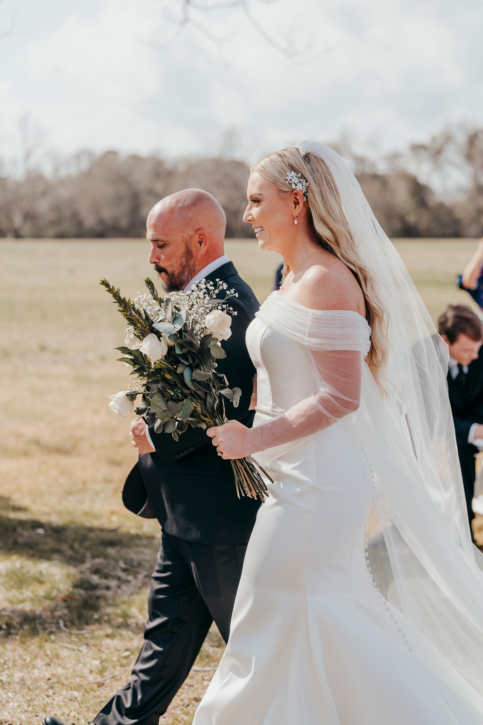 bride walking down the aisle at Agapae Oaks Wedding